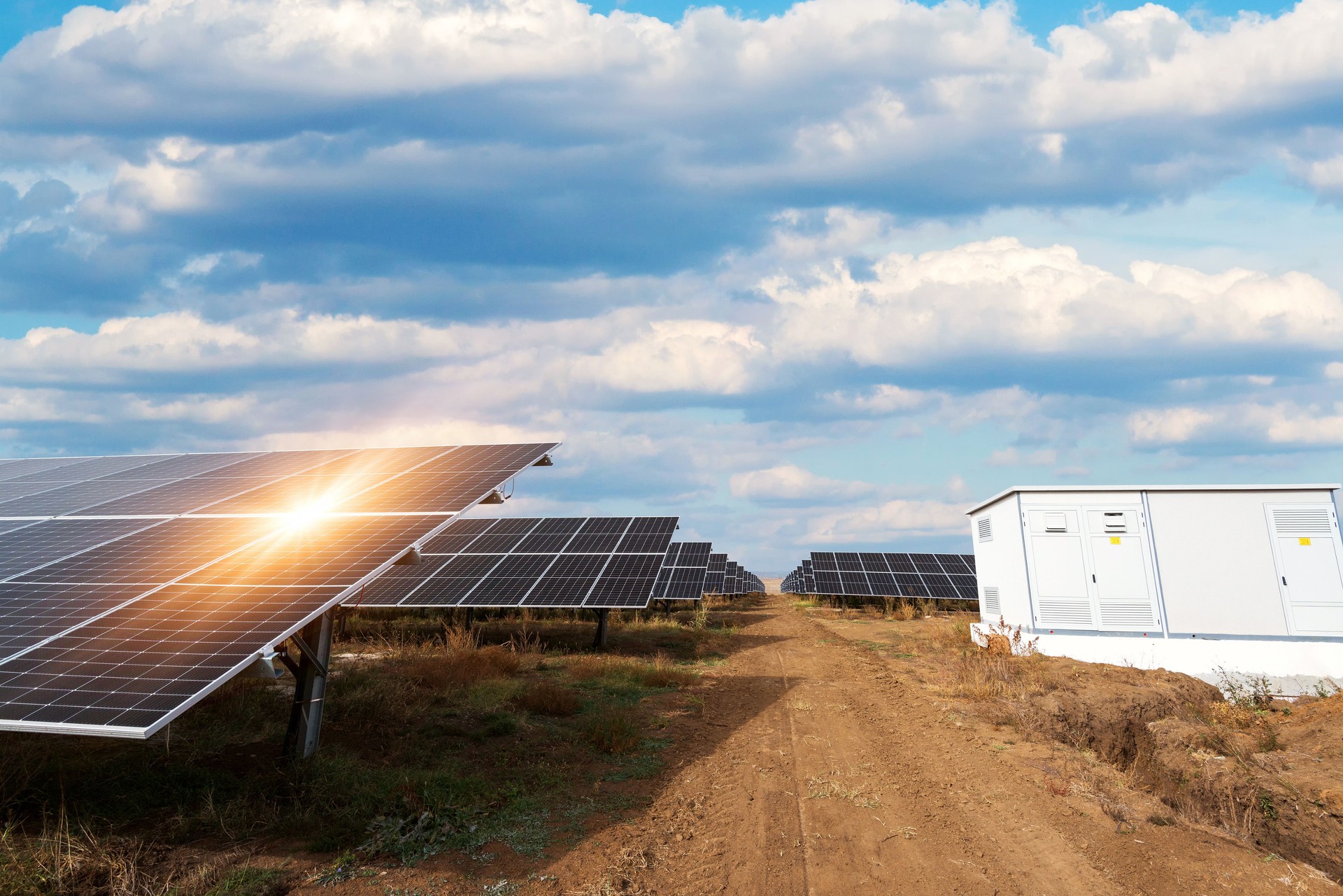Bilateral solar panels, photovoltaics with sun reflection - alternative source of electricity, concept of sustainable and renewable resources. Panoramic view.